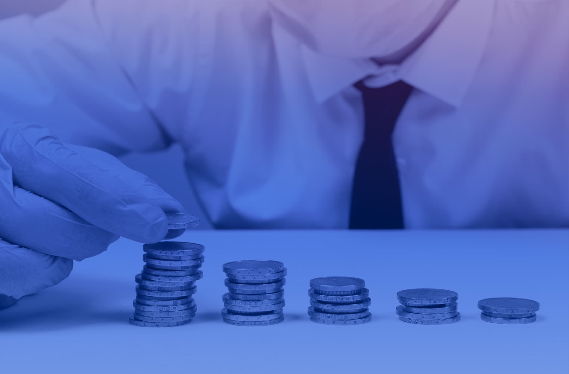 Cover photo of a person counting coins in piles to picture a topic of trying to find funding for a MedTech project